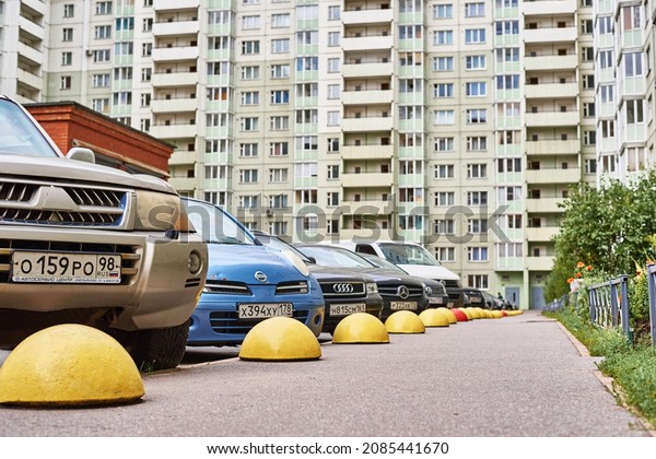Car parked near parking barriers in\
residential condominium. Parking problem in sleeping areas of the\
city. Saint Petersburg, Russia - August 09,\
2019