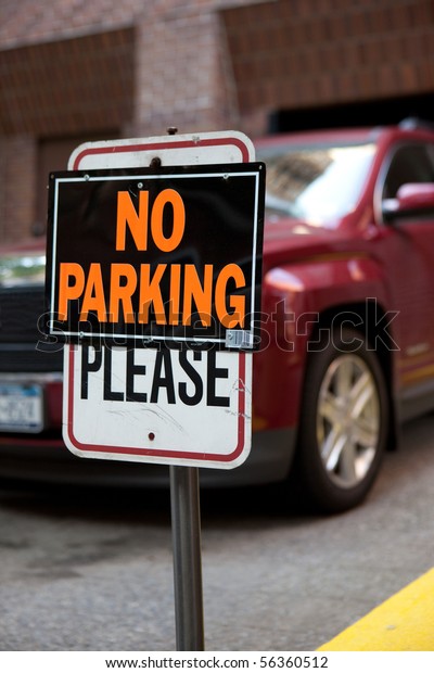 Car parked in\
no parking zone, breaking the\
law