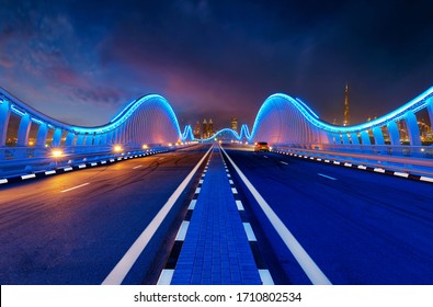 Car Parked on bridge in Dubai Meydan Bridge is one of the most VIP iconic bridges know in DUBAI. With a twisty edge to edge top it looks stunning. 