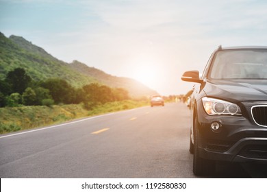 Car Parked On Road And Small Passenger Car Seat On The Road Used For Daily Trips