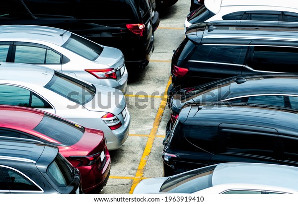 Car parked at parking lot of the airport for
rental. Aerial view of car parking lot of the airport. Used luxury
car for sale and rental service. Automobile parking space. Car
dealership concept.