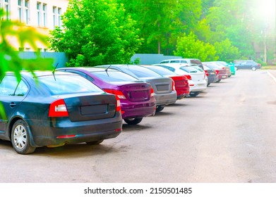 Car Parked In The Yard, Taken In Backlit And Sun Glare. 