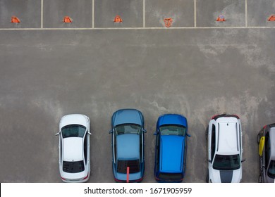 Car parking aerial top view. Occupied and vacant lots with vehicles. Park marked area of modern urban structure. City landscape pattern