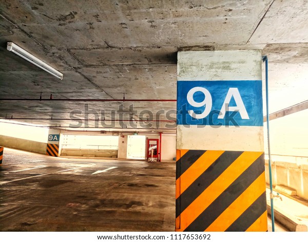 Car\
parking area sign shining warm light for\
background