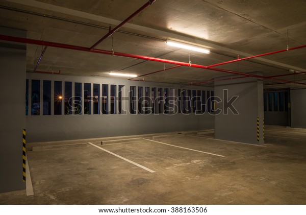 Car parking
garage interior warm lights in
dark