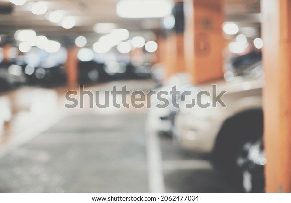 Car parking indoor of supermarket\
store blurred bokeh with tonned transport\
background