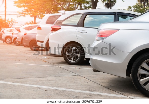 Car parking\
in line and car running\
background.