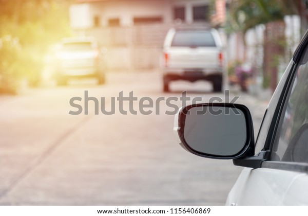 Car parking on the asphalt\
road. Car in the city on street. Automobile background with\
sunlight.