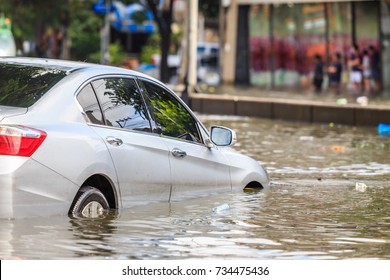 Car Parking On The Street And Show Level Of Water Flooding In Bangkok, Thailand