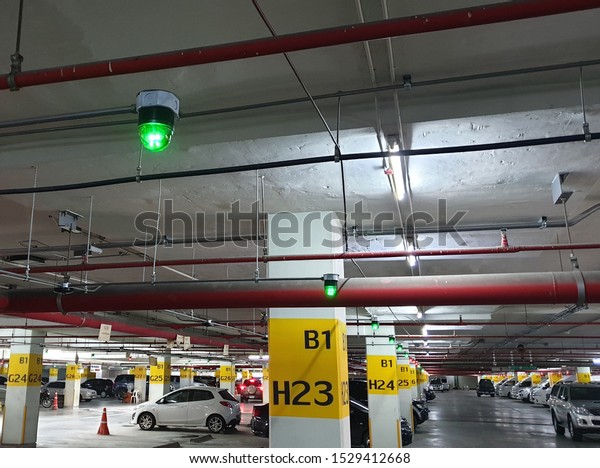 Car Parking lot sensor, Parking\
lot Guidance System with Overhead Indicators on ceiling that\
Indicator Light show Parking space unoccupied is\
green.\
