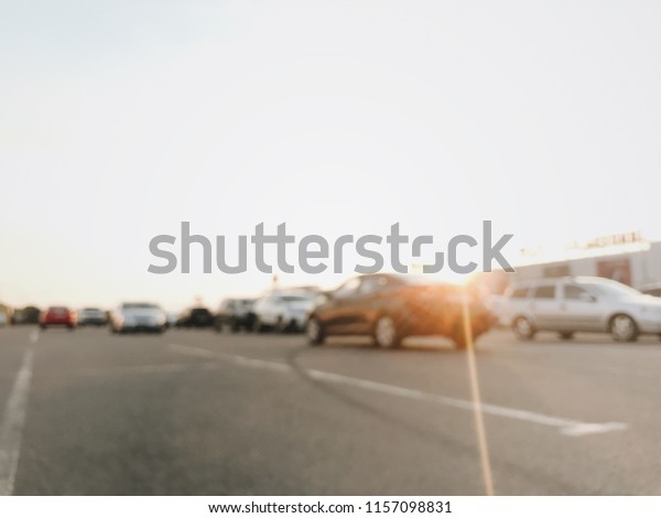 car parking at a shopping center, supermarket.\
cars in the parking lot. Abstract blurred car in parking\
background. illustration to article of Parking lot. blurred photo.\
vintage photo processing