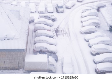 Car Parking Under The Snow. View From The Window.