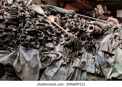 Car Parts In Old Warehouses. Used Vehicle Part For Recycling In The Scrap Yard Garage. Recycle Goods, Metal. Abstract Industrial Background.