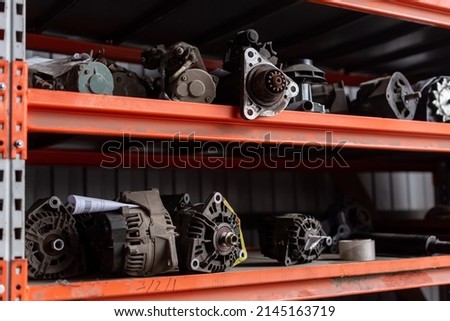 Car parts in old warehouses. Used vehicle part for recycling in the scrap yard garage.
