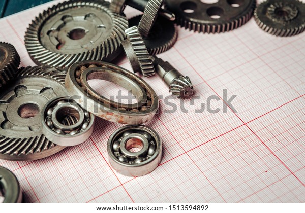 Car
parts on graph paper close up. Engineering
concept