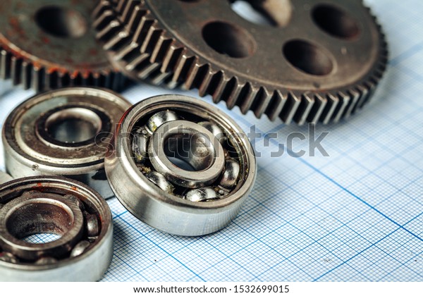 Car parts on\
graph paper for car\
engineering