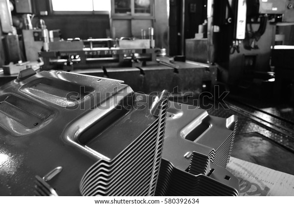 Car parts Produced by Accurate\
Sheet Metal Stamping Tool Die. Black-and-white\
photo.