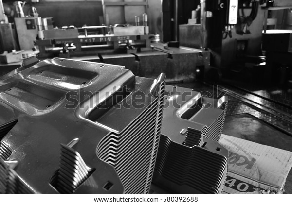 Car parts Produced by Accurate
Sheet Metal Stamping Tool Die. Black-and-white
photo.