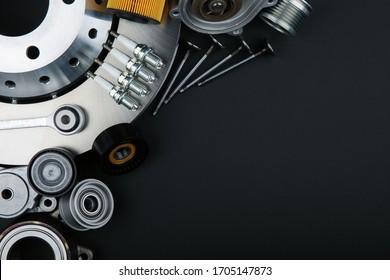 car parts top view on black background with copy space. spark plugs, valves and other parts of a car engine on a black background with empty space - Shutterstock ID 1705147873