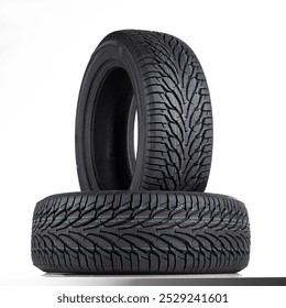 Car Parts - Two new winter tires for a car on a white background.