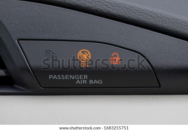 Car passenger airbags warning lights tag, modern\
car safety feature.