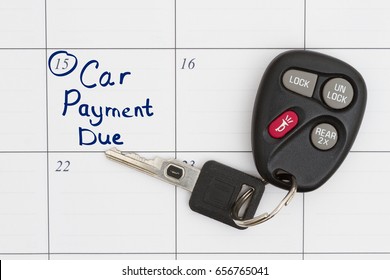 Car Payment Due Text With Car Key And Remote Opener On A Calendar