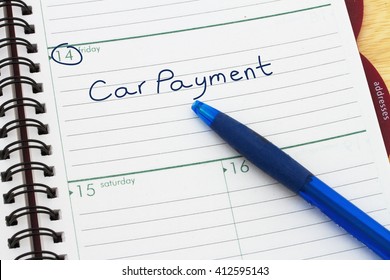 Car Payment Is Dues, A Day Planner With Blue Pen With Text Car Payment