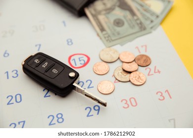 Car Payment With Car Key And Remote Opener On A Calendar