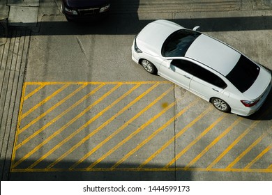 Car And People On The Street Looking From A High Angle.