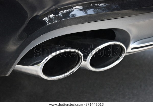 Car pipe.\
Exhaust. Double exhaust pipes of a\
car