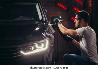 Car Polish Wax. Worker Hands Holding A Polisher And Polish Car