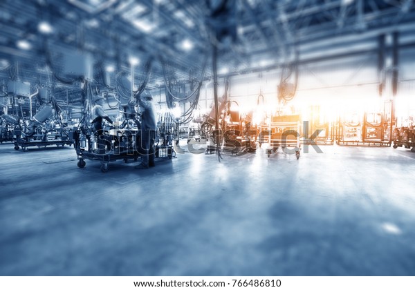Car\
production line, skilled workers are working\
tense.