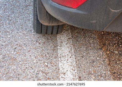 The Car Pulled Over To The Side Of The Road Behind A Solid Line.