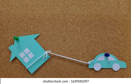 Car Pulling A House Model Paper Cutout. House As Collateral Property For Auto Loan