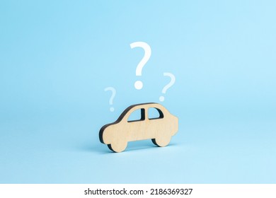 Car and question mark. Car selection concept. Blue background. - Shutterstock ID 2186369327