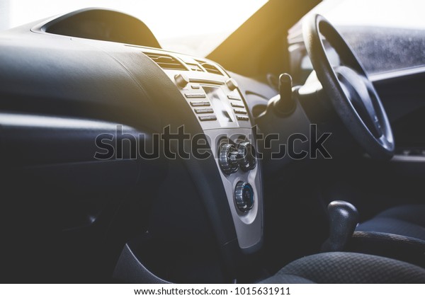 Car\
radio and air system,Button on dashboard in car\
panel