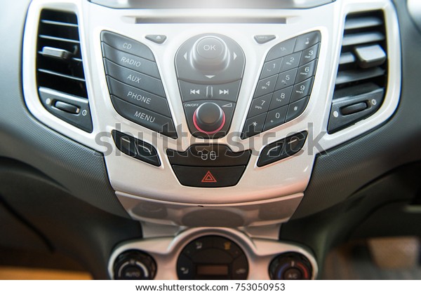Car radio and phone system,Button on dashboard in\
car panel