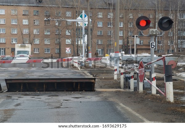Car at a railway crossing. Train travel at a\
railway crossing.