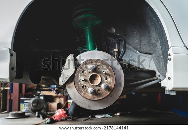 Car\
rear brake calipers and disc brake rotor\
service.