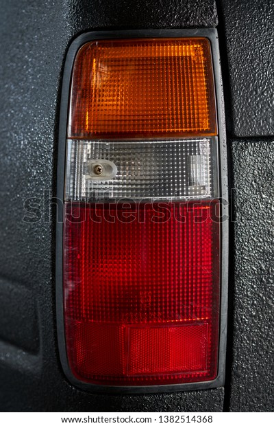 car rear light\
close-up on dark background