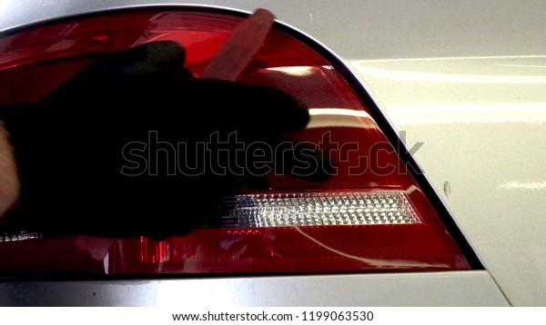 at The car,\
rear light is removed in\
workshop