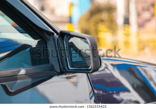 Car Rear View Mirror\
Blurred Background