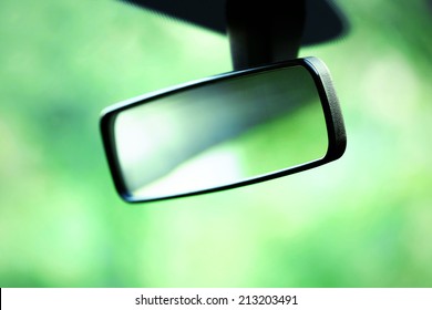 Car Rear View Mirror On Green Background