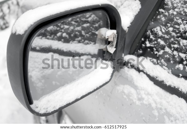 Car rear view mirror in the\
snow