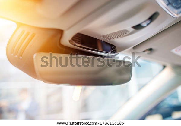 Car Rear view mirror, soft focus. White interior of
a new modern car.