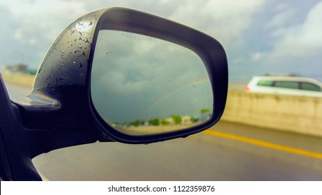 Car Rear View Mirror While Running On The Road.