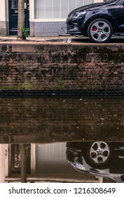 Car reflection on a canal
