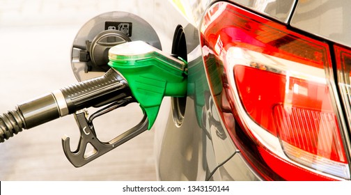 Car Refuel At The Petrol Station. Concept Photo For Use Of Fuels (gasoline, Diesel, Ethanol) In Combustion Engines, Air Pollution And Environmental And Occupational Health, Oil Price. 