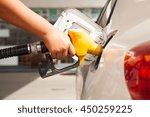 Car refueling on petrol station. To fill the machine with fuel.  Fuel pump at station. Man pumping gasoline fuel in car at gas station.