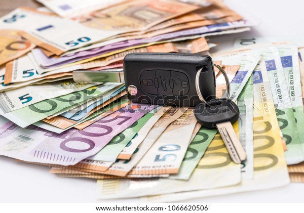 Car rent or\
purchasing, euro money with\
keys